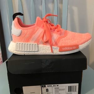 Women’s Adidas NMD athletic shoes.